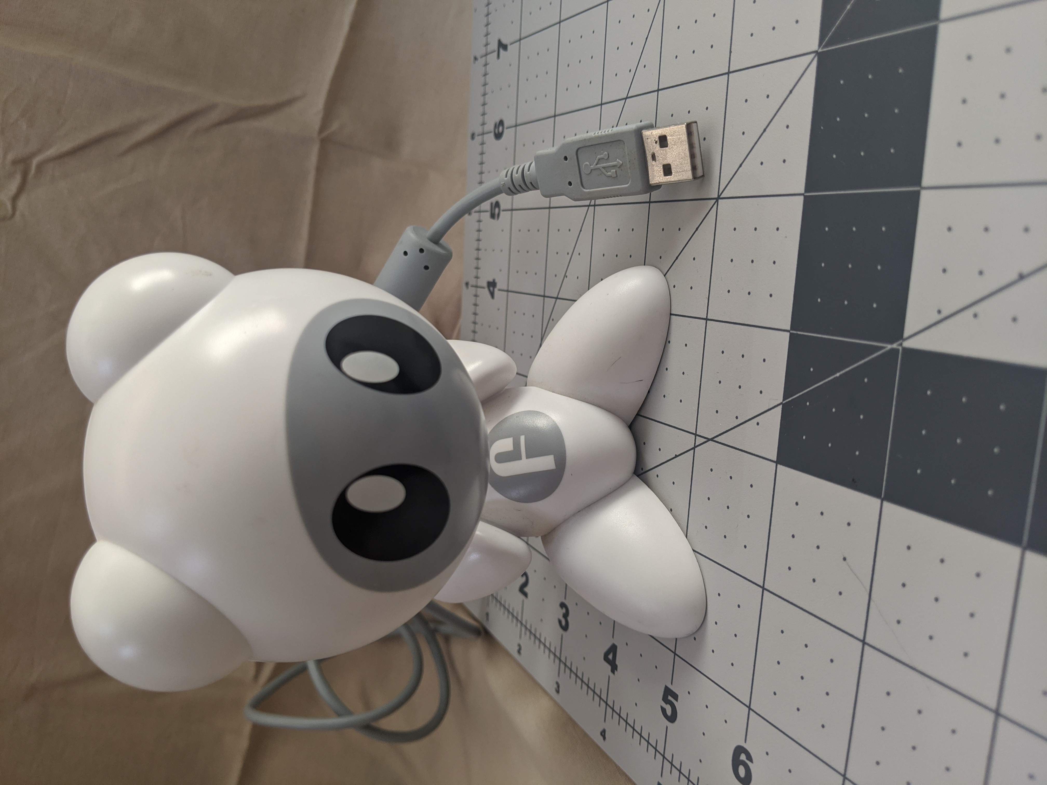 The hub looks just like a funkey, but it much larger. Additionally a USB A cable comes out the back like a tail.